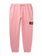 Stone Island - Tapered Logo-Appliquéd Garment-Dyed Cotton-Jersey Sweatpants - Pink