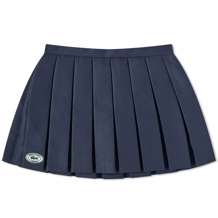 Photo: Sporty & Rich x Lacoste Tennis Pleated Mini Skirt in Marine