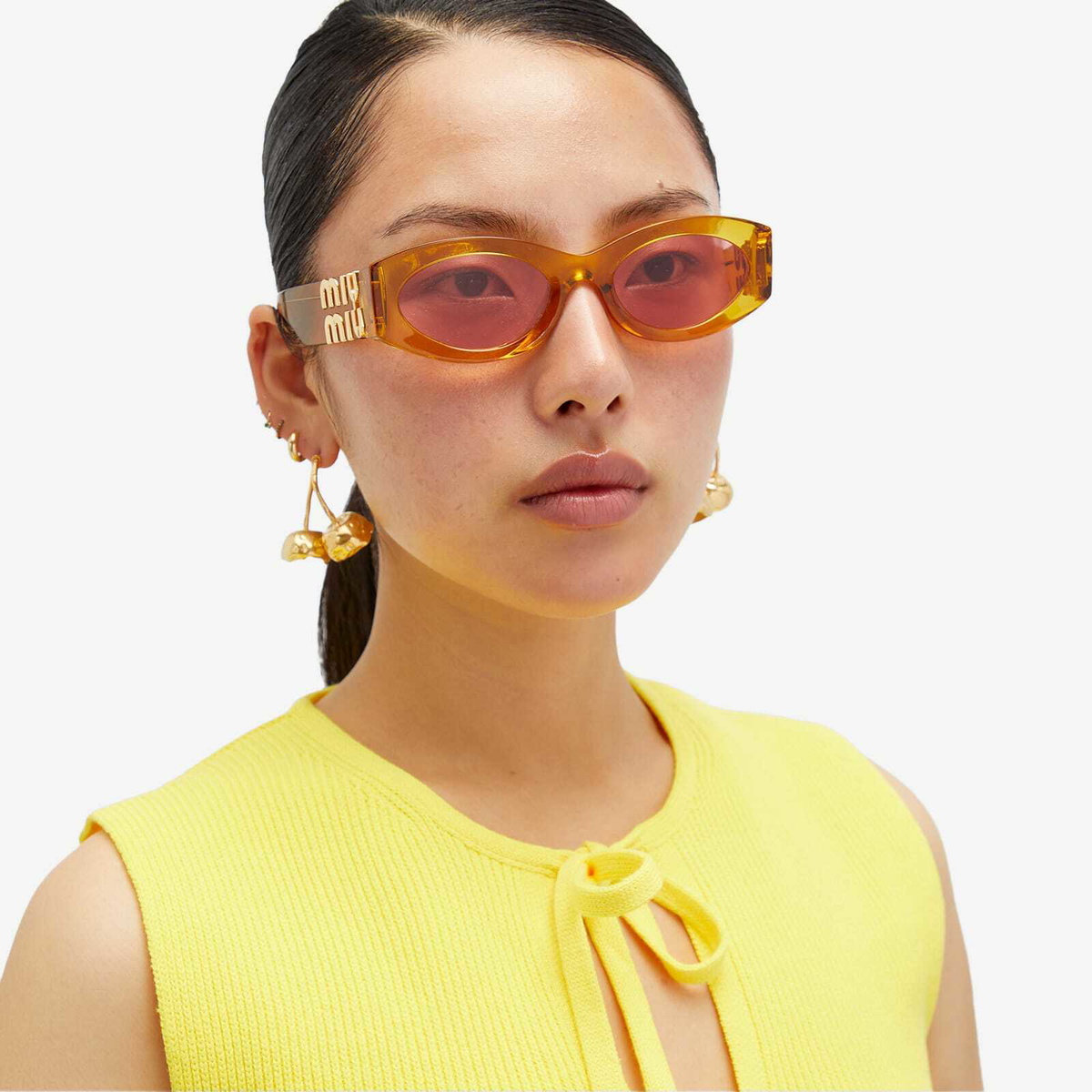 Miu Miu Eyewear Women's 11WS Sunglasses in Orange Transparent/Pink