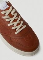 GG Embossed Basket Sneakers in Brown