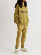 Fear of God Essentials - Tapered Logo-Print Cotton-Blend Jersey Sweatpants - Yellow