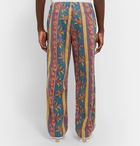 Stüssy - Tapered Printed Cotton-Twill Trousers - Blue