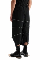 COMME DES GARCONS BLACK cropped pants with zip openings. Black
