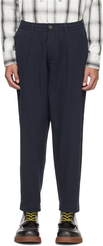 Photo: Universal Works Navy Pleated Trousers