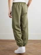 Nike - Solo Swoosh Tapered Logo-Embroidered Cotton-Blend Jersey Sweatpants - Green