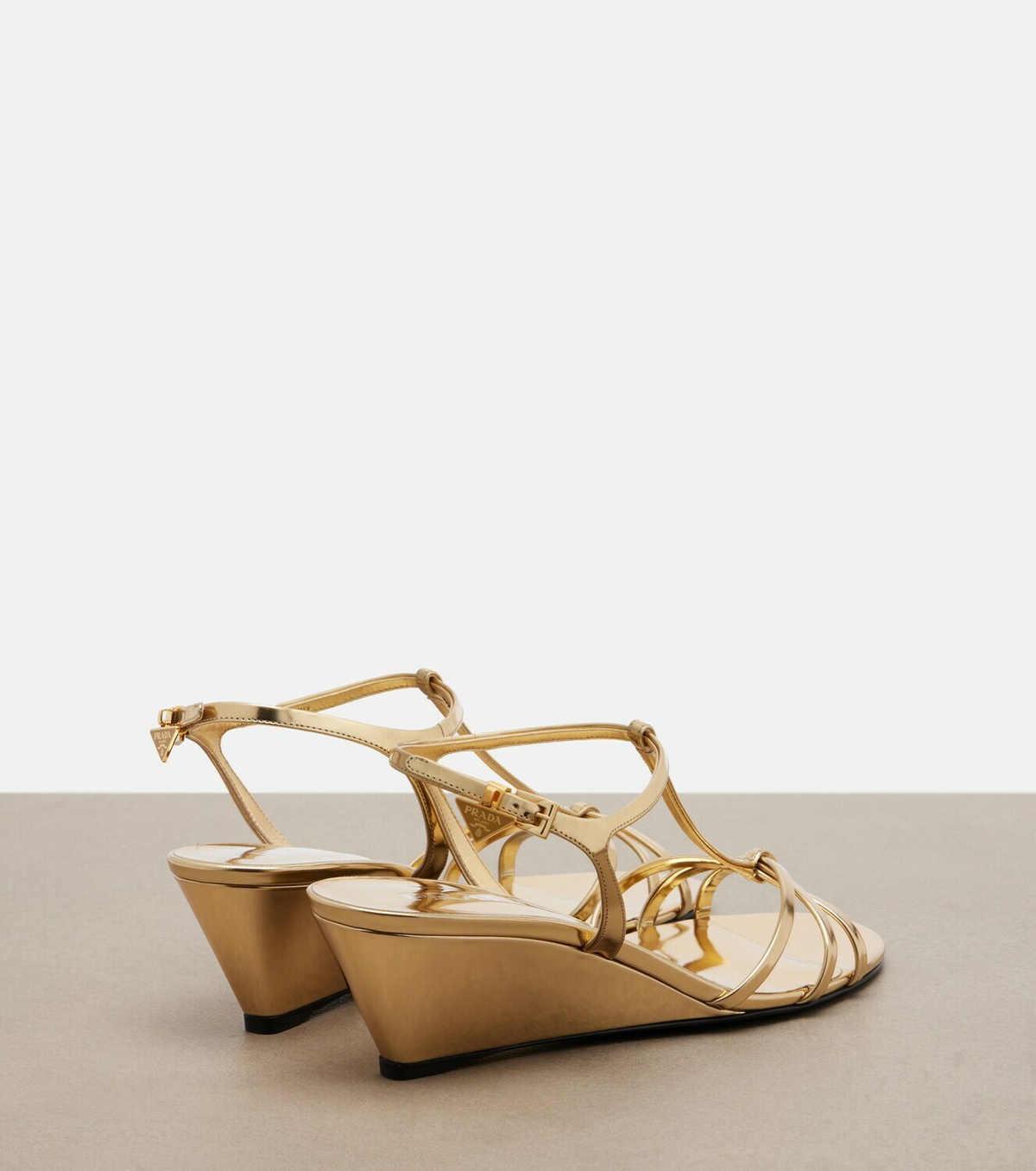 Prada Metallic leather wedge sandals