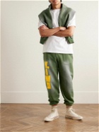 Y,IWO - Hardwear Logo-Print Distressed Cotton-Jersey Sweatpants - Green