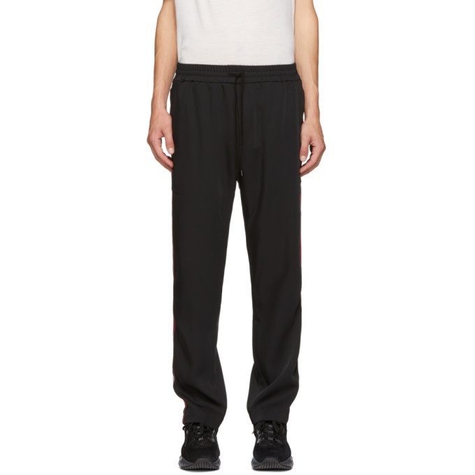 Photo: CMMN SWDN Black and Red Buck Track Pants