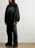 Balenciaga - Wide-Leg Distressed Logo-Appliquéd Cotton-Jersey Sweatpants - Black