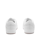 Woman by Common Projects Women's Decades Low Trainers Sneakers in White