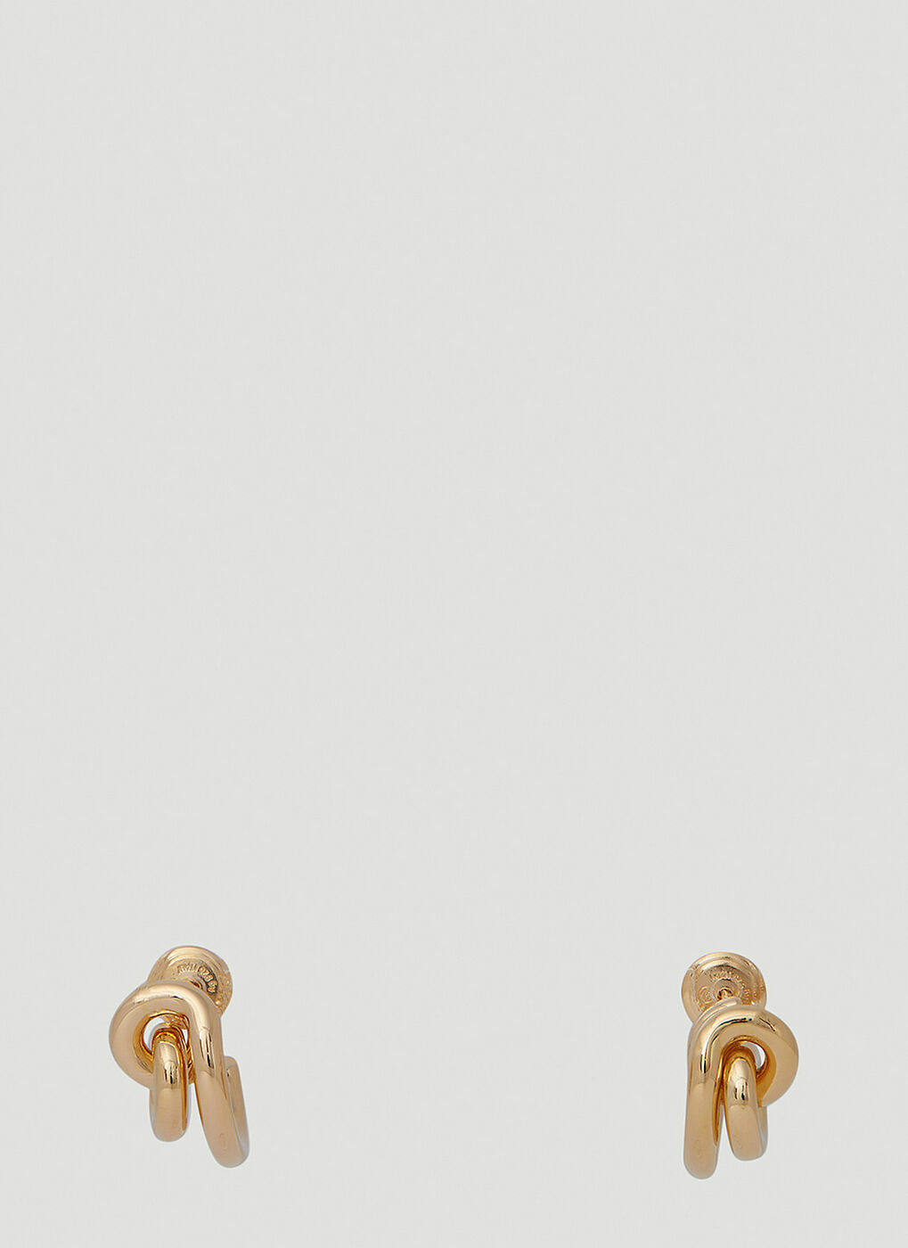 Bottega Veneta® Women's Triangle Hoop Earrings in Silver. Shop