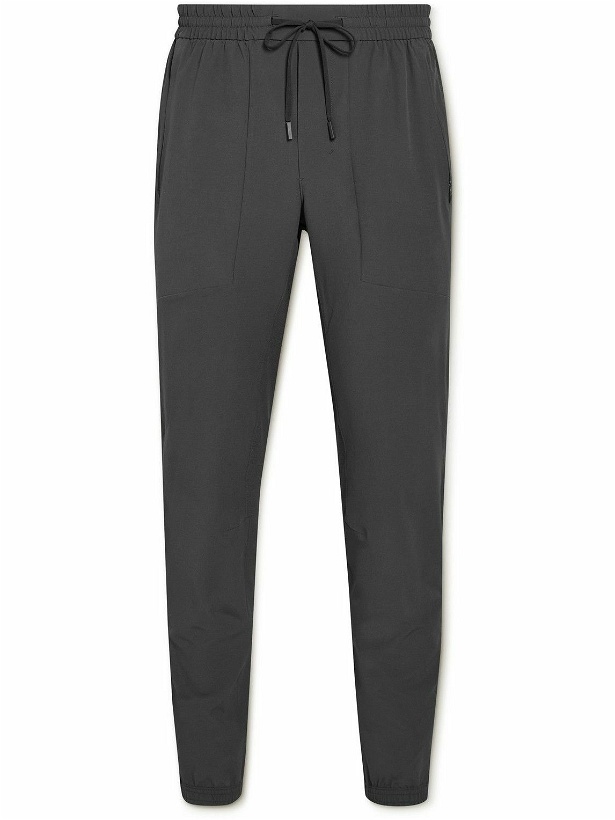 Photo: Lululemon - License to Train Tapered Recycled Stretch-Shell Track Pants - Gray