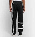 Givenchy - Tapered Logo-Embroidered Loopback Cotton-Jersey Sweatpants - Black