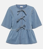 Ganni Striped bow-trimmed peplum denim blouse