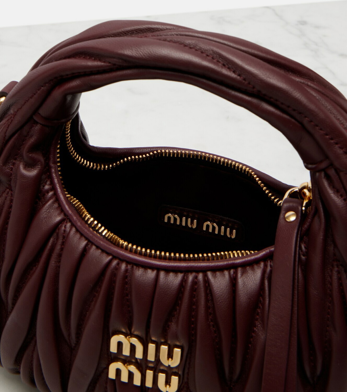 Miu Miu Wander Mini matelassé leather top-handle bag