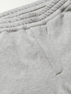 Alexander McQueen - Tapered Logo-Print Mélange Loopback Cotton-Jersey Sweatpants - Gray