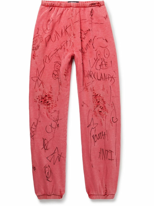 Photo: Liberal Youth Ministry - Juvenile Tapered Distressed Printed Cotton-Blend Jersey Sweatpants - Red