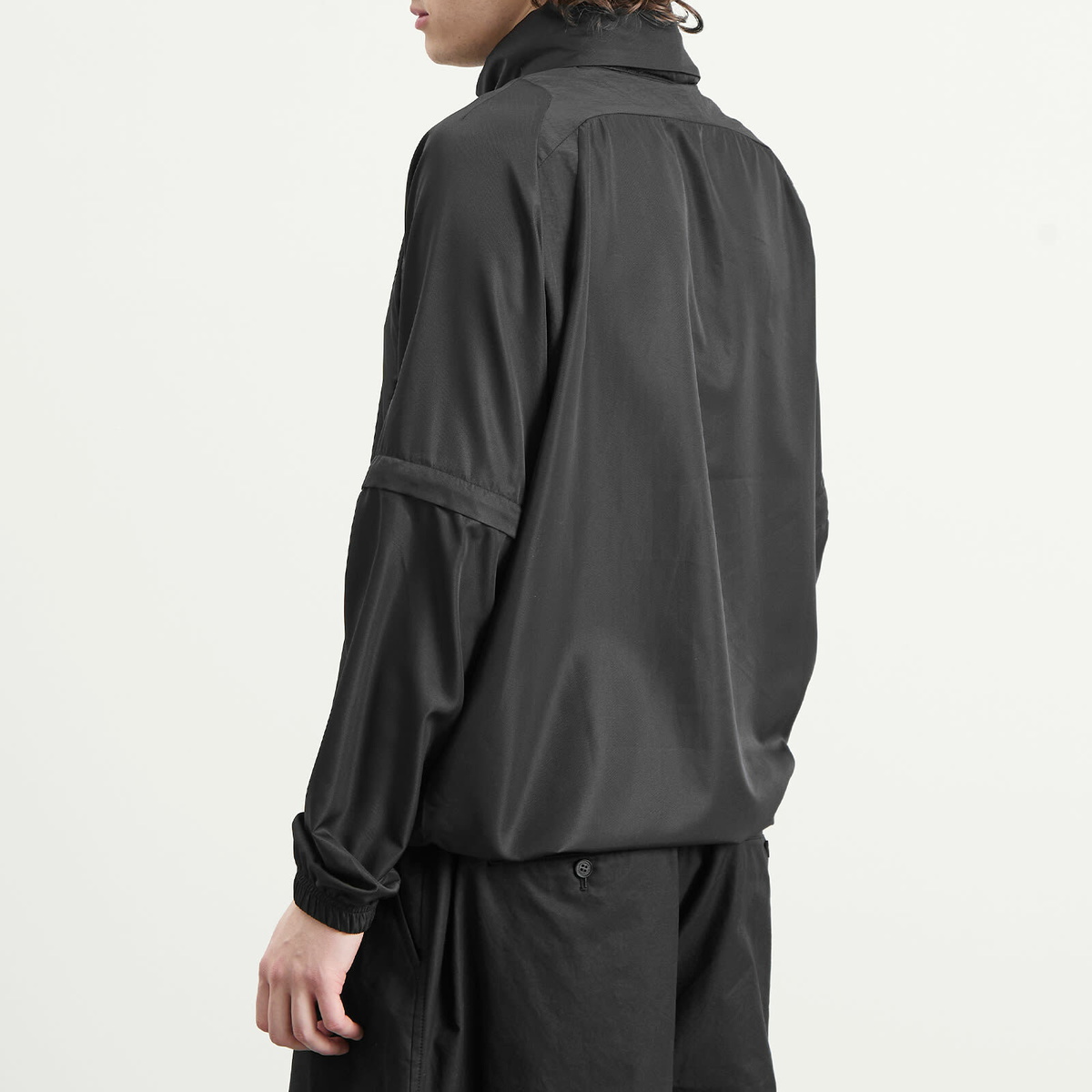 Umbro Men's Zip Off Sleeve Wind Jacket in Black