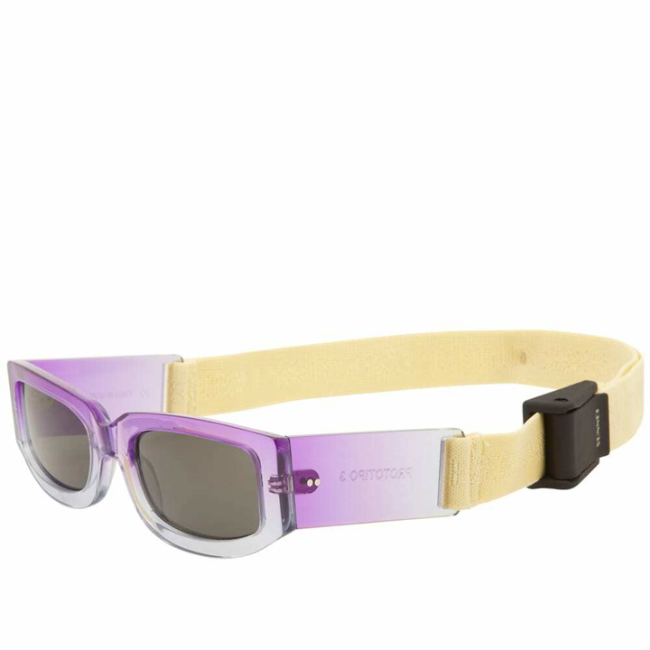 Photo: Sunnei Women's Sunglasses With Rubber Logo Band in Gradient Purple
