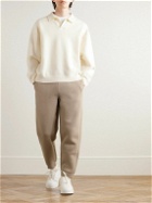 AMI PARIS - Tapered Logo-Embossed Cotton-Blend Sweatpants - Neutrals