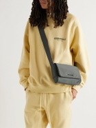 Fear of God - Logo-Appliquéd Leather-Trimmed Shell Messenger Bag
