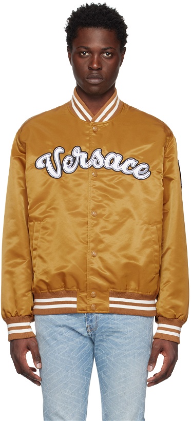 Photo: Versace Gold Varsity Bomber Jacket