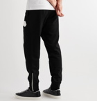 Moncler - Tapered Logo-Appliquéd Loopback Cotton-Jersey Sweatpants - Black