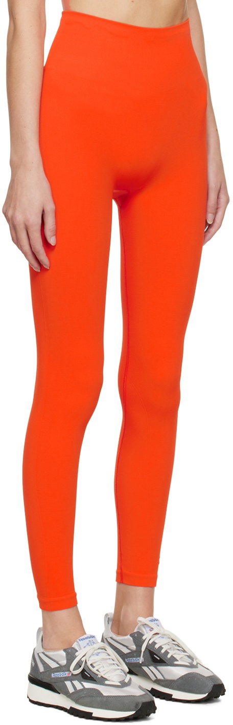 https://cdn.clothbase.com/uploads/5c19b423-441c-4720-beaf-e19b7ab3c60c/orange-seamless-sport-leggings.jpg