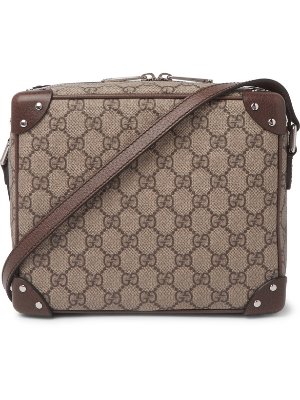 Photo: GUCCI - Studded Leather-Trimmed Monogrammed Coated-Canvas Messenger Bag - Brown