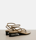 Alaïa Invisible patent leather wedge thong sandals