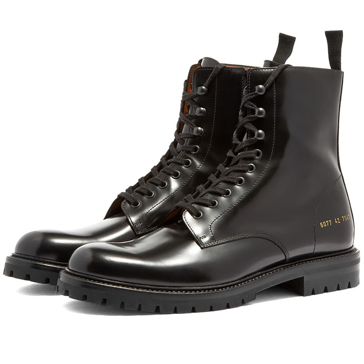 Photo: Woman by Common Projects Combat Boot