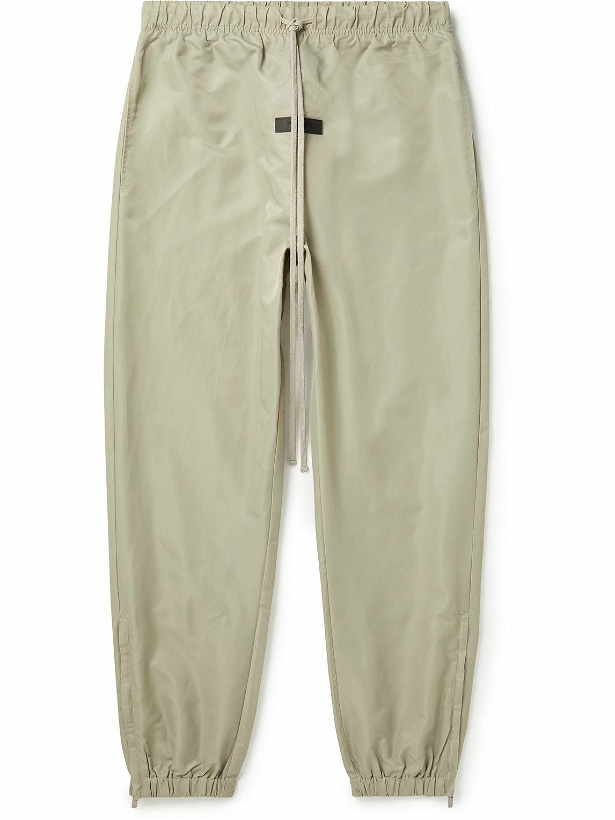 Photo: FEAR OF GOD ESSENTIALS - Slim-Fit Tapered Logo-Appliquéd Nylon Sweatpants - Gray