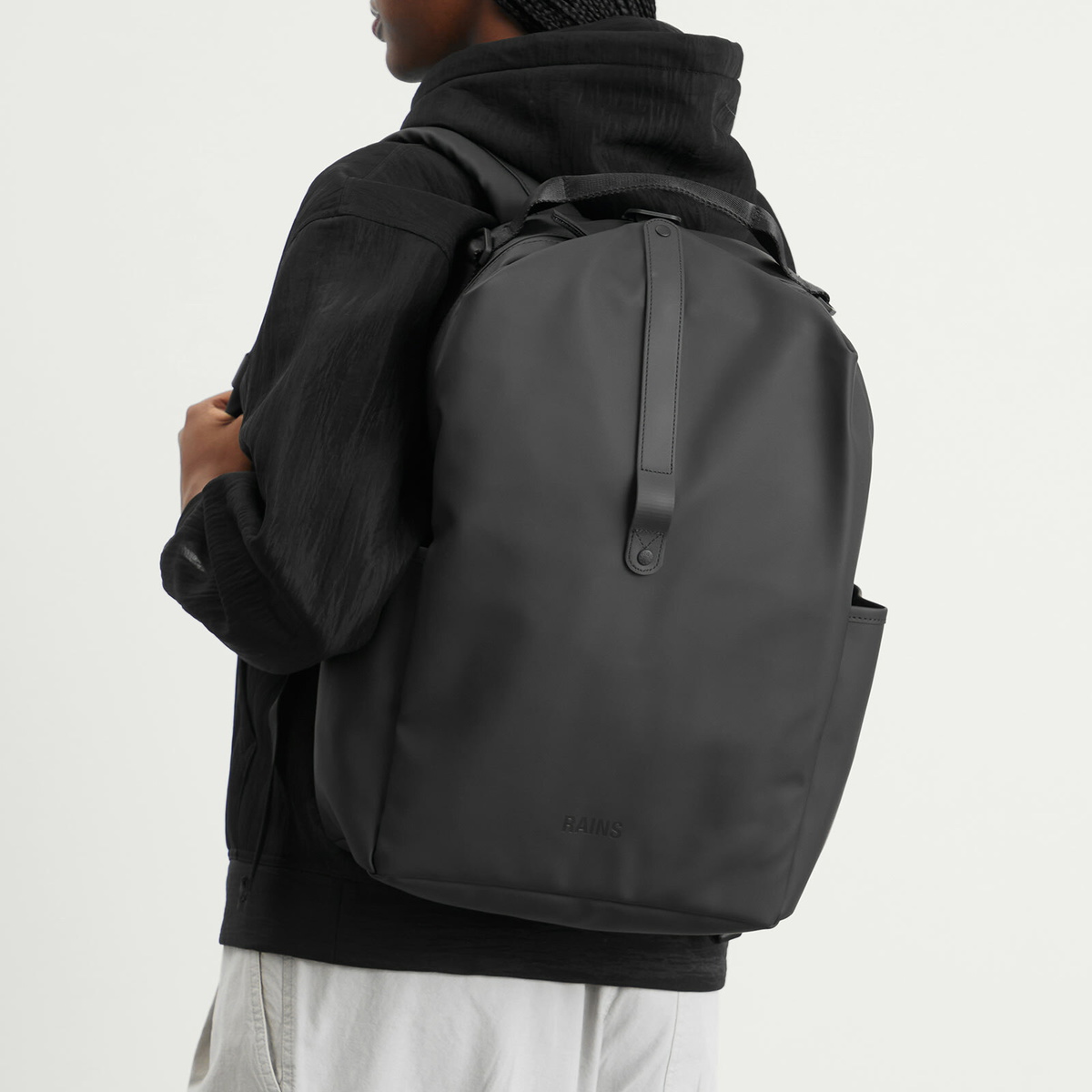 RAINS Clip Front Backpack in Black 