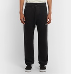 AMIRI - Tapered Printed Loopback Cotton-Jersey Sweatpants - Black