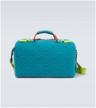 Gucci Embossed GG leather-trimmed duffel bag