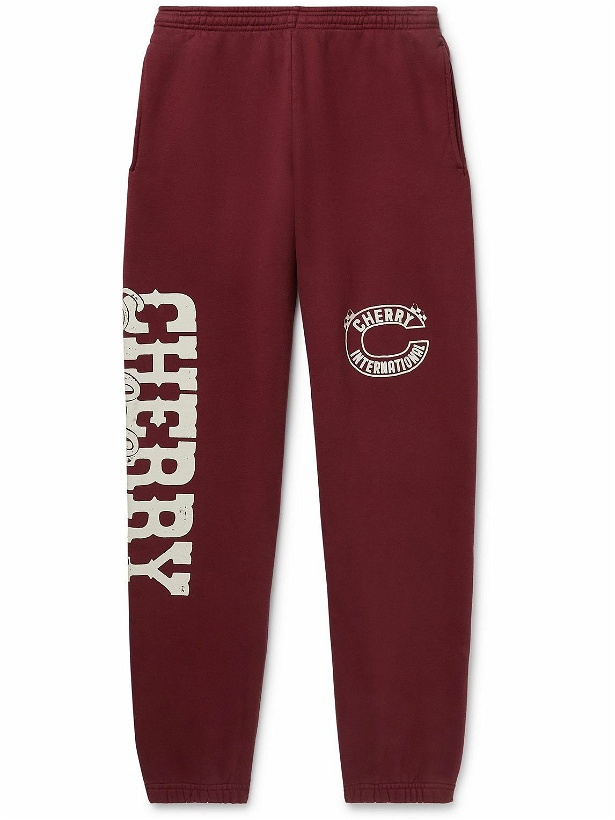 Photo: CHERRY LA - Tapered Logo-Print Cotton-Jersey Sweatpants - Burgundy