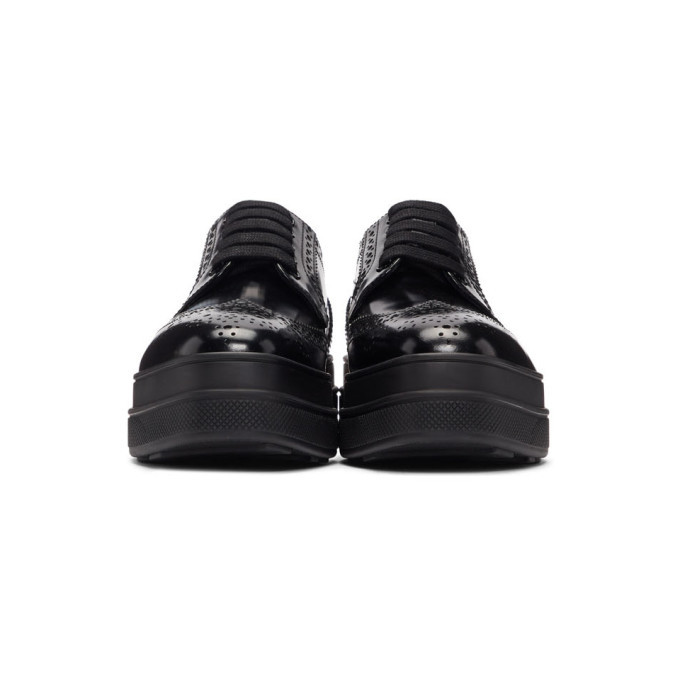 Leather platform brogues in black - Prada