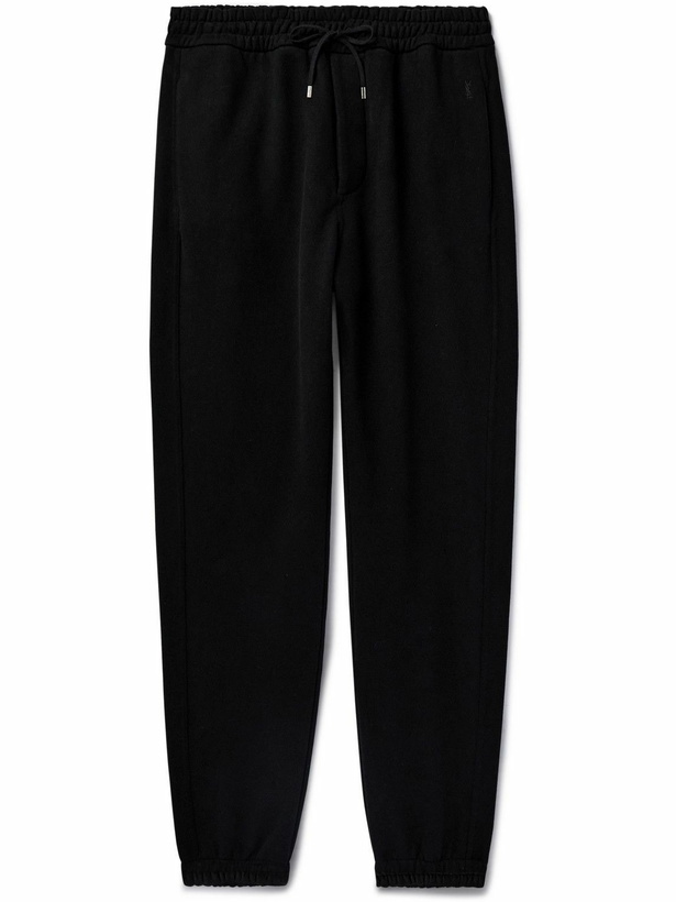 Photo: SAINT LAURENT - Tapered Logo-Embroidered Cotton-Jersey Sweatpants - Black
