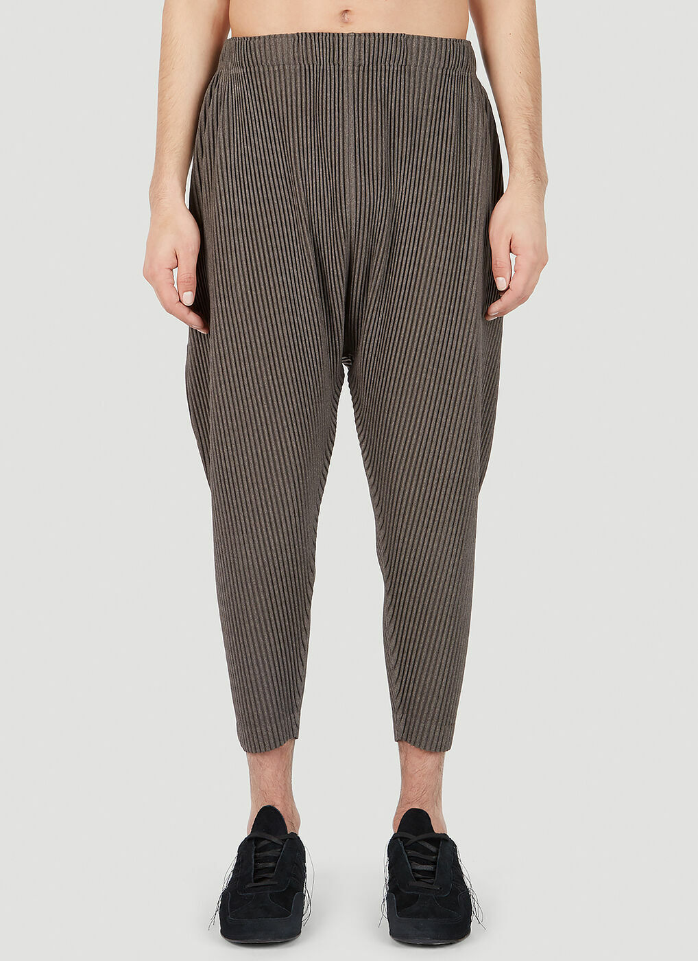 Homme Plissé Issey Miyake - Pleated Tapered Pants in Brown Homme Plissé Issey Miyake - Pleated Tapered Pants in Brown