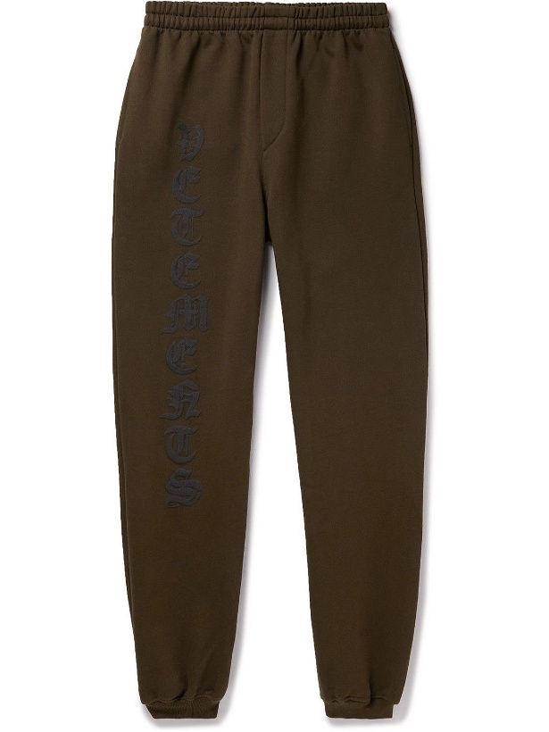 Photo: VETEMENTS - Tapered Logo-Flocked Cotton-Blend Jersey Sweatpants - Brown