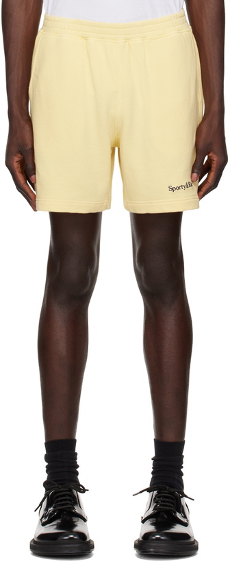 Photo: Sporty & Rich Yellow Serif Logo Gym Shorts