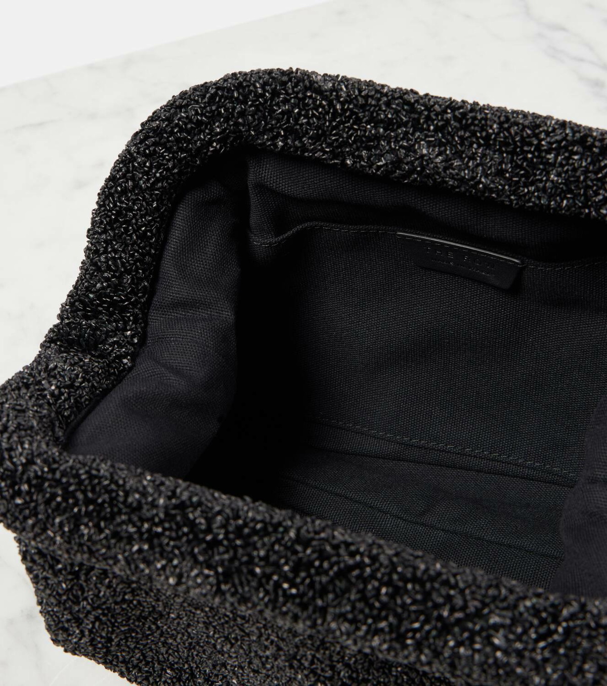 The Row Mira raffia-effect clutch The Row