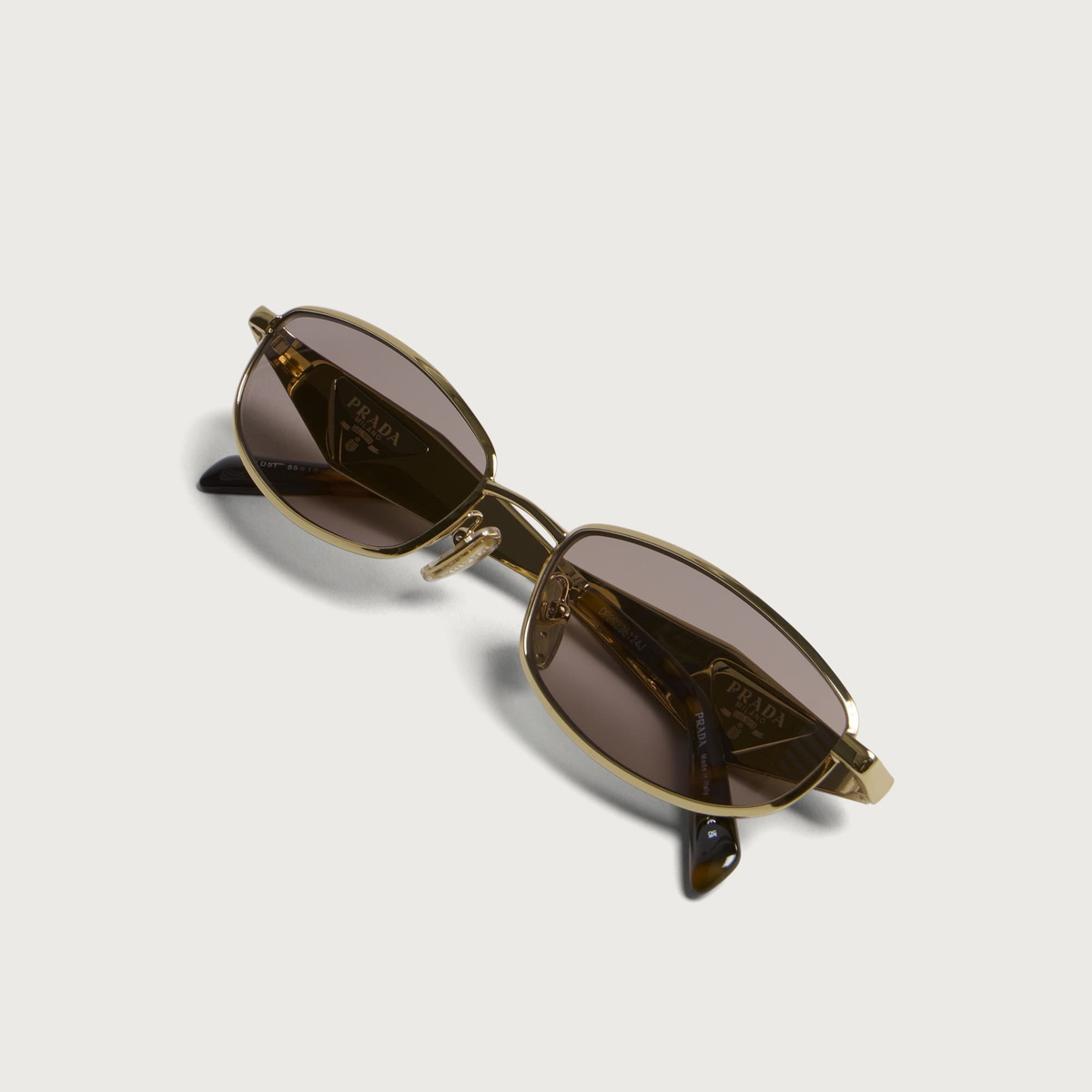 Prada Eyewear D51S Sunglasses in Gold/Light Purple Brown