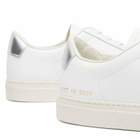 Woman by Common Projects Women's Retro Classic Trainers Sneakers in White/Silver