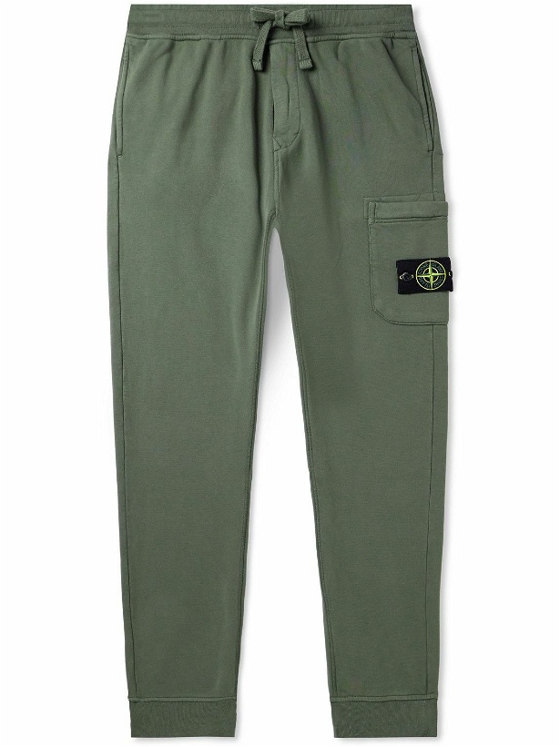 Photo: Stone Island - Tapered Logo-Appliquéd Garment-Dyed Cotton-Jersey Sweatpants - Green
