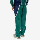New Balance Men's Hoops Woven Pant in Team Forest Green