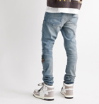AMIRI - Skinny-Fit Distressed Appliquéd Panelled Stretch-Denim Jeans - Blue