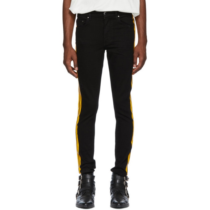 Photo: Amiri Black and Yellow Stack Track Jeans