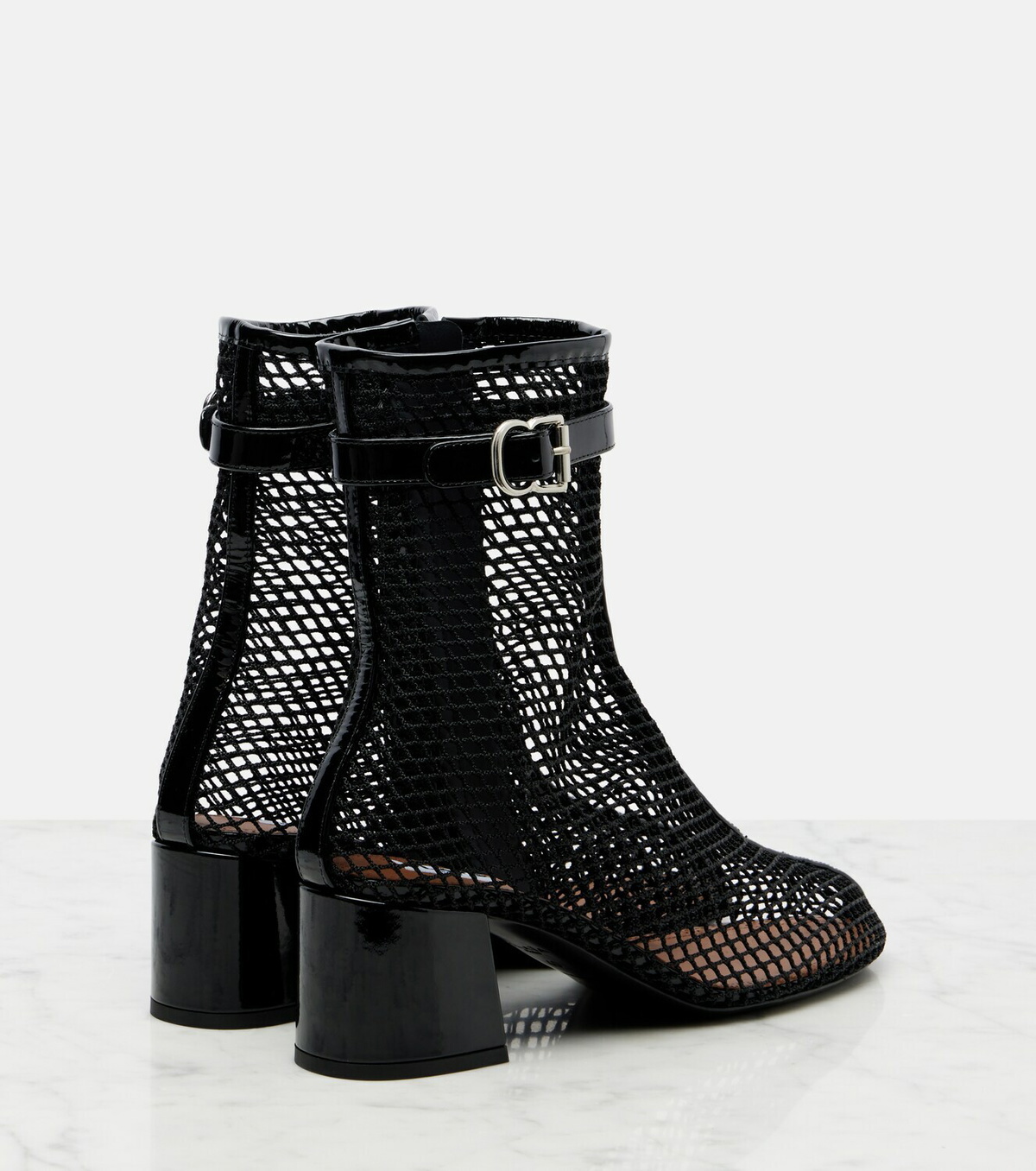 Alaïa Fishnet patent leather-trimmed ankle boots
