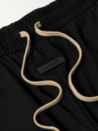Fear of God - Tapered Logo-Appliquéd Shell Sweatpants - Black